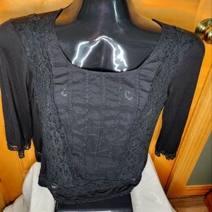 Women's lightweight, lace trimmed waist length feminine shirt.